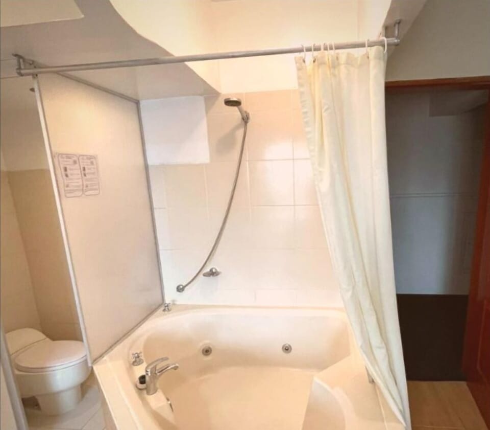 Shower, designer toiletries, towels
