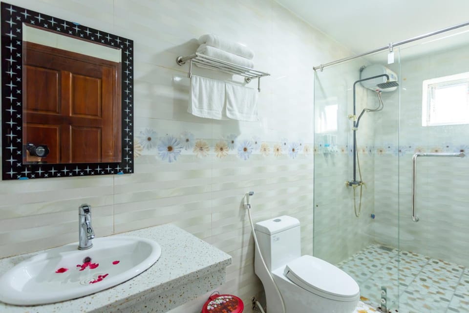 Shower, hair dryer, slippers, towels