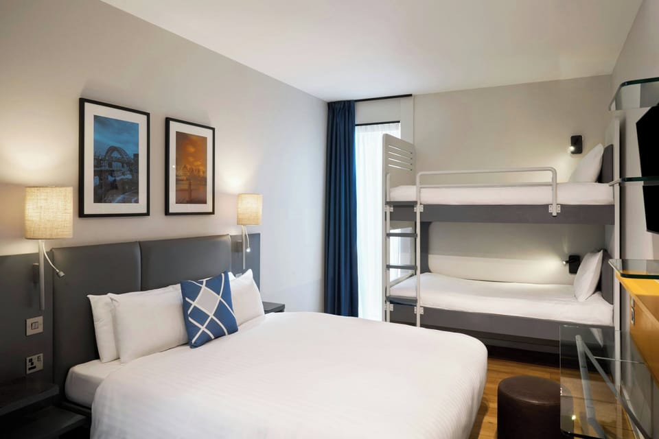 Family Room | In-room safe, desk, blackout drapes, iron/ironing board