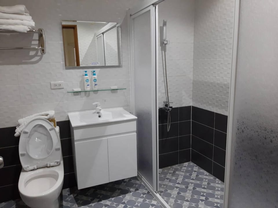 Shower, free toiletries, hair dryer, slippers