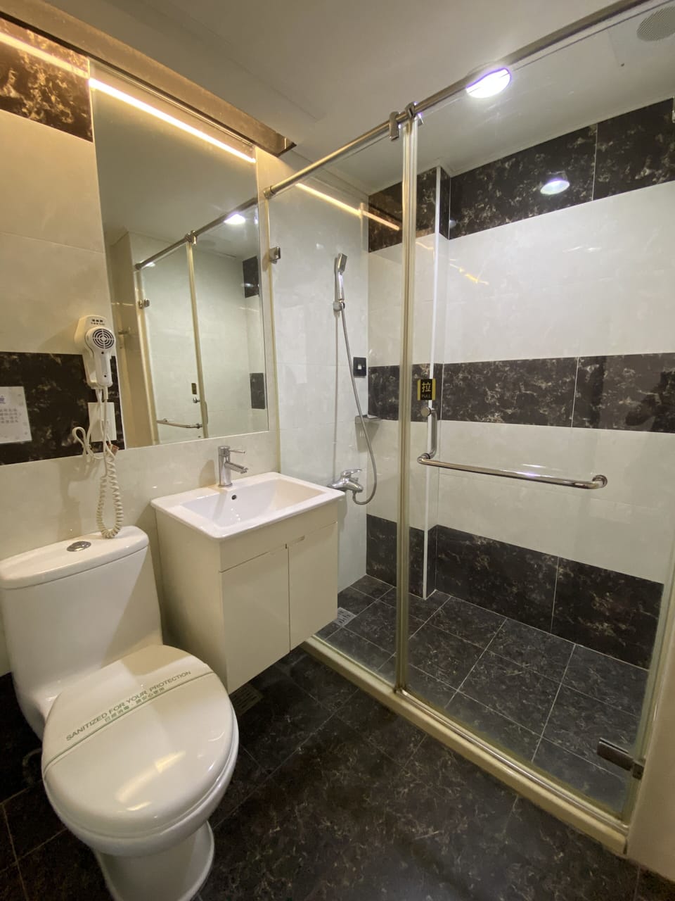 Shower, free toiletries, hair dryer, slippers