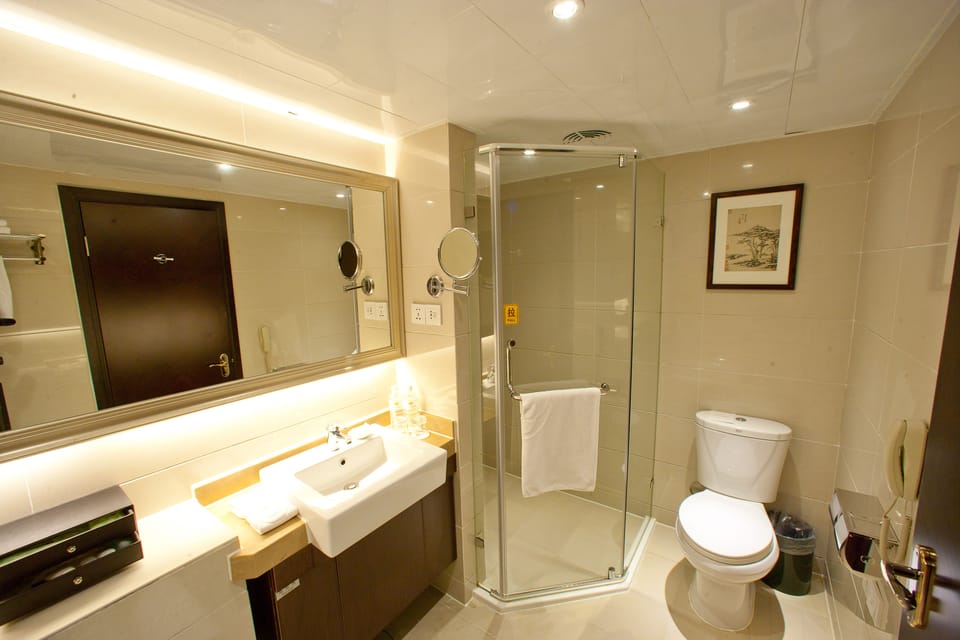 Separate tub and shower, rainfall showerhead, free toiletries