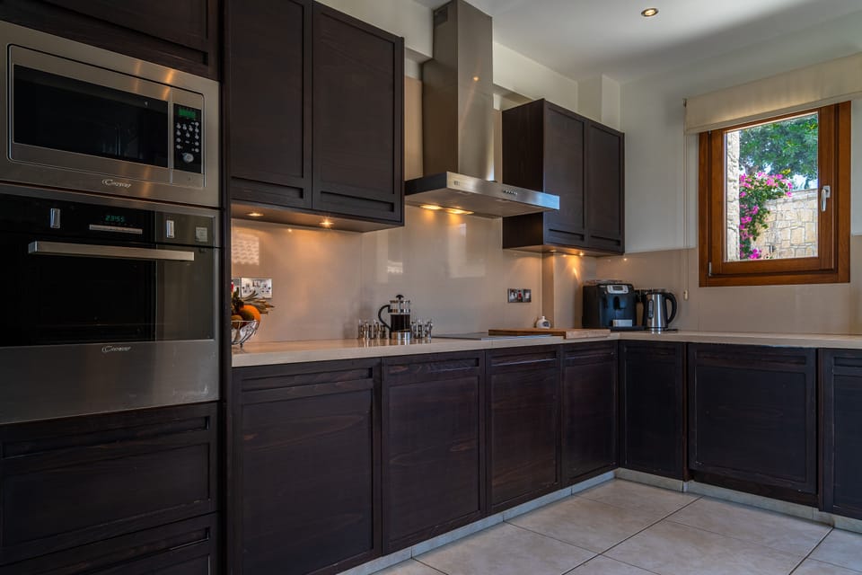 Villa | Private kitchen | Coffee/tea maker, full-size fridge, microwave, oven