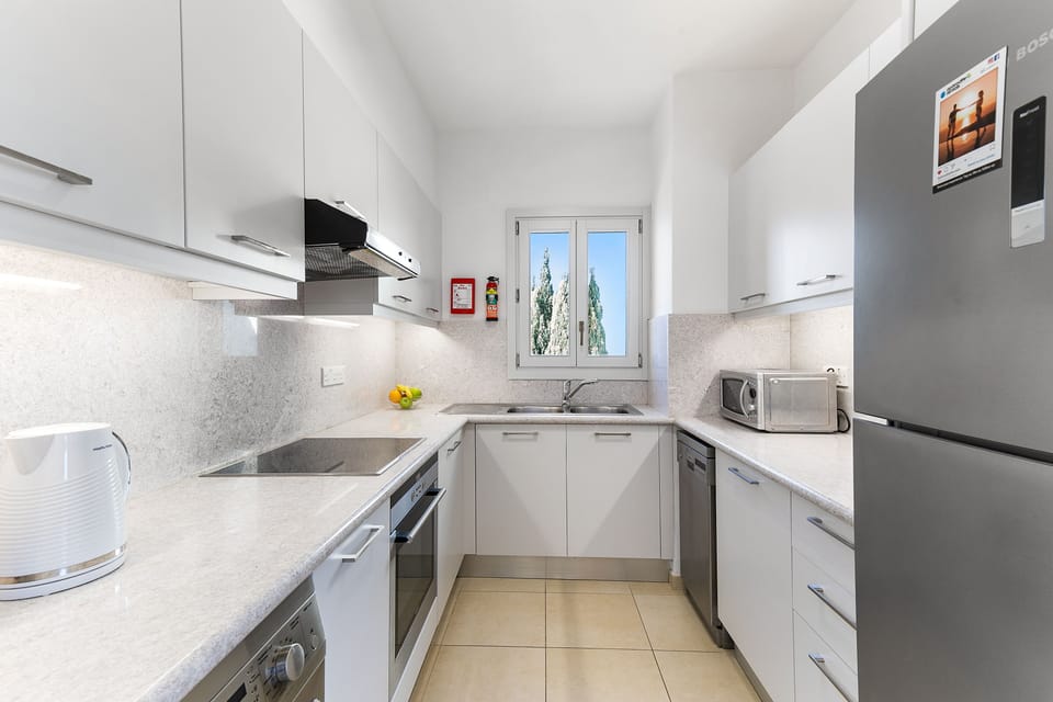 Apartment, 2 Bedrooms | Private kitchen | Full-size fridge, microwave, oven, stovetop
