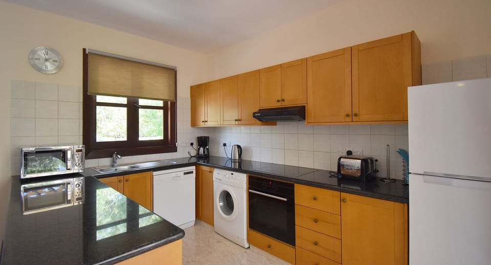 Villa | Private kitchen | Coffee/tea maker, full-size fridge, microwave, stovetop