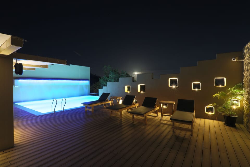 Outdoor pool, open 8:00 AM to 8:00 PM, pool umbrellas, sun loungers