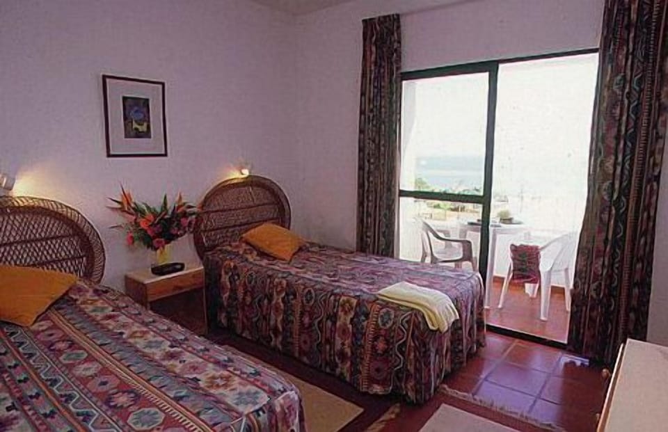 Apartment, 1 Bedroom | Minibar, iron/ironing board, free WiFi, bed sheets