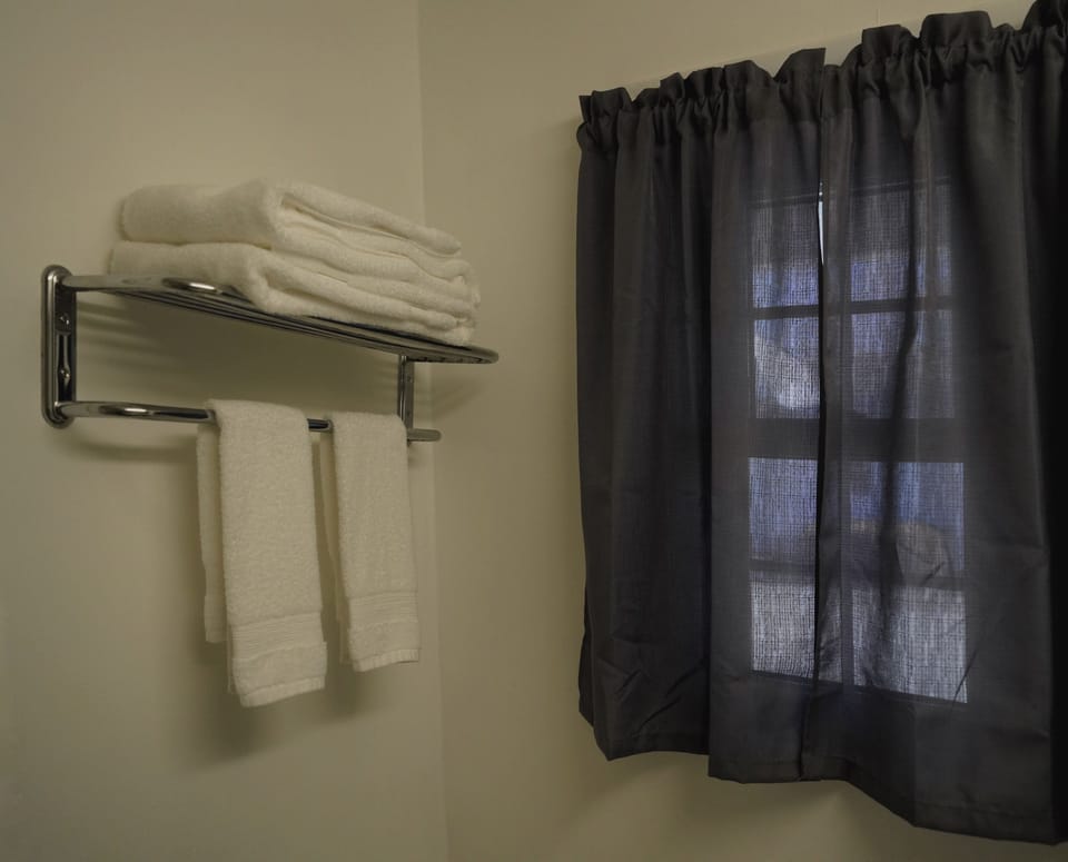 Exclusive Room, 2 Queen Beds, Non Smoking | Bathroom | Combined shower/tub, free toiletries, hair dryer, towels