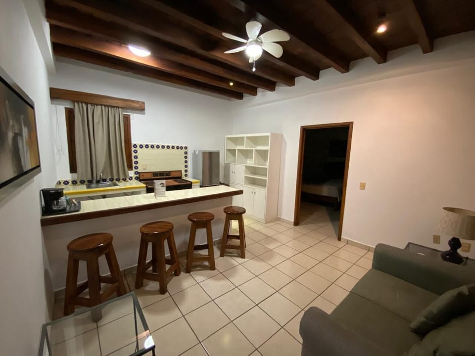 Deluxe Studio Suite | Living area | 32-inch TV with cable channels
