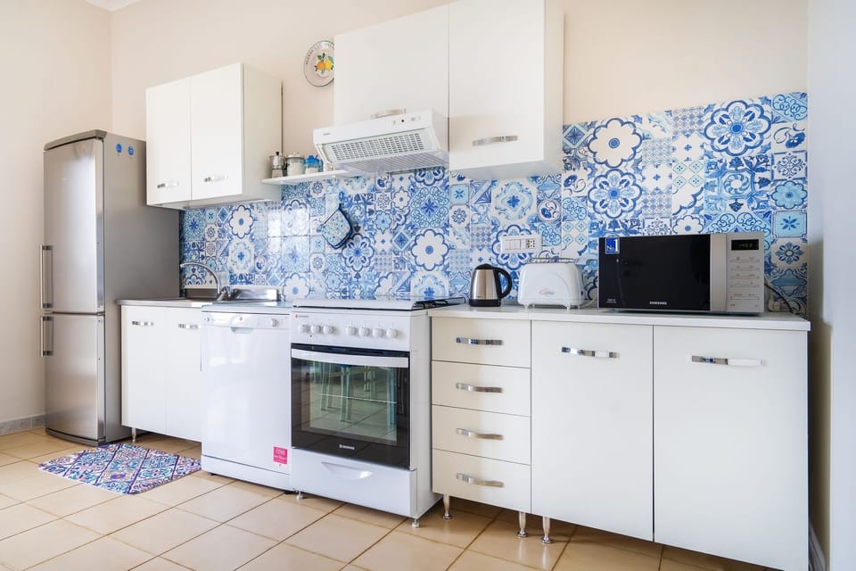 Apartment, 2 Bedrooms, Patio, Sea View | Private kitchen | Full-size fridge, microwave, oven, stovetop