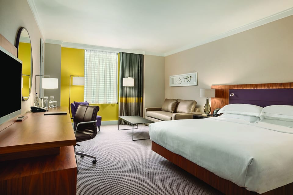 Room, 1 King Bed | Down comforters, in-room safe, desk, soundproofing