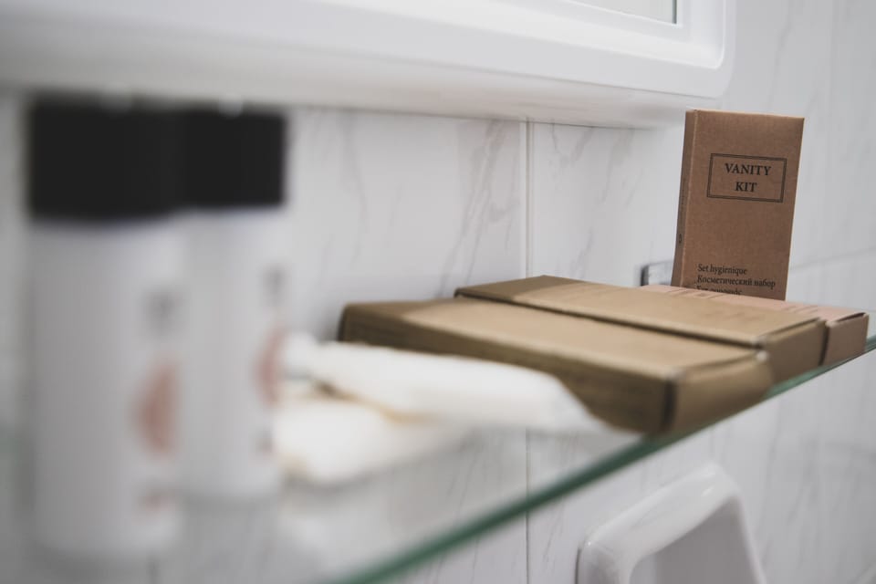 Shower, designer toiletries, hair dryer, slippers