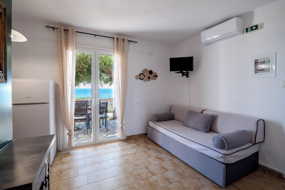 Apartment, 1 Bedroom, Smoking, Garden View | Living room | TV