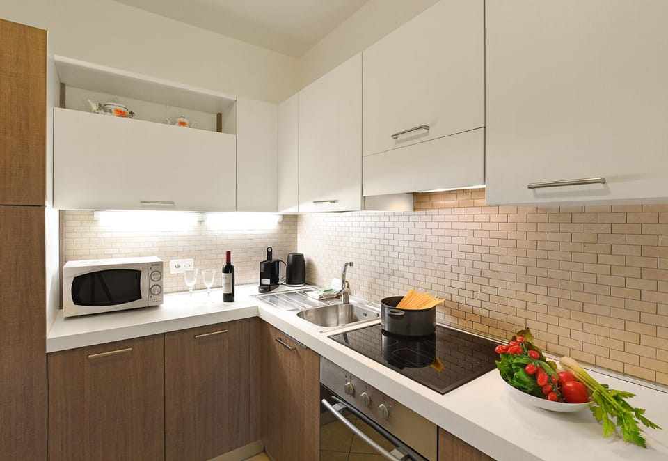 Family Apartment, Multiple Bedrooms (Santiago Home) | Private kitchen | Full-size fridge, microwave, oven, stovetop