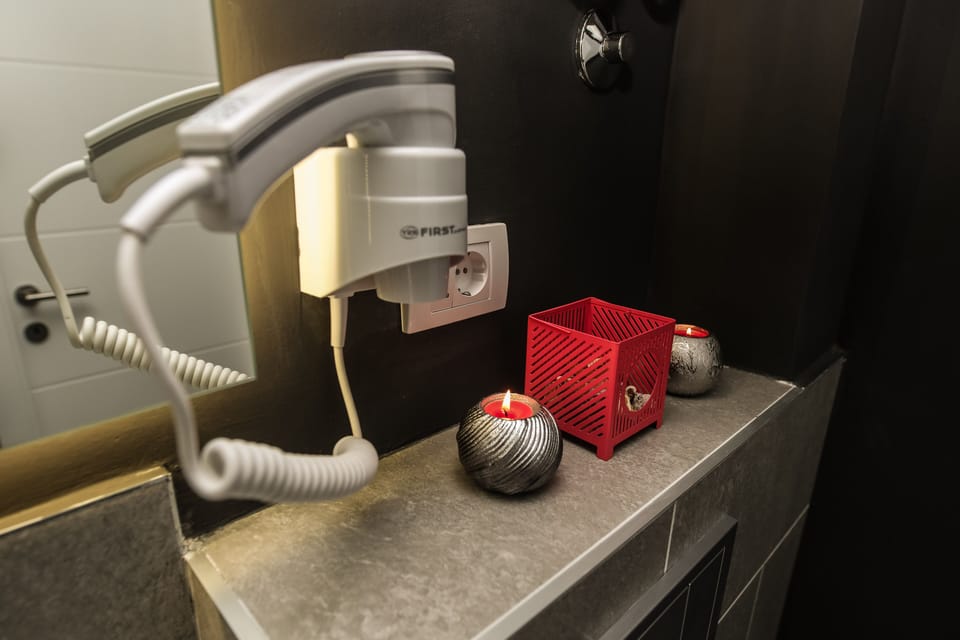 Shower, free toiletries, hair dryer, slippers