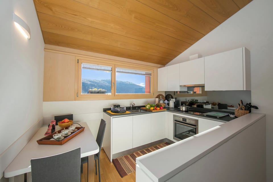 Family Townhome, 2 Bedrooms, Balcony, Mountainside (Ca' Melin with Balcony & Fireplace) | Private kitchen | Coffee/tea maker, full-size fridge, microwave, oven