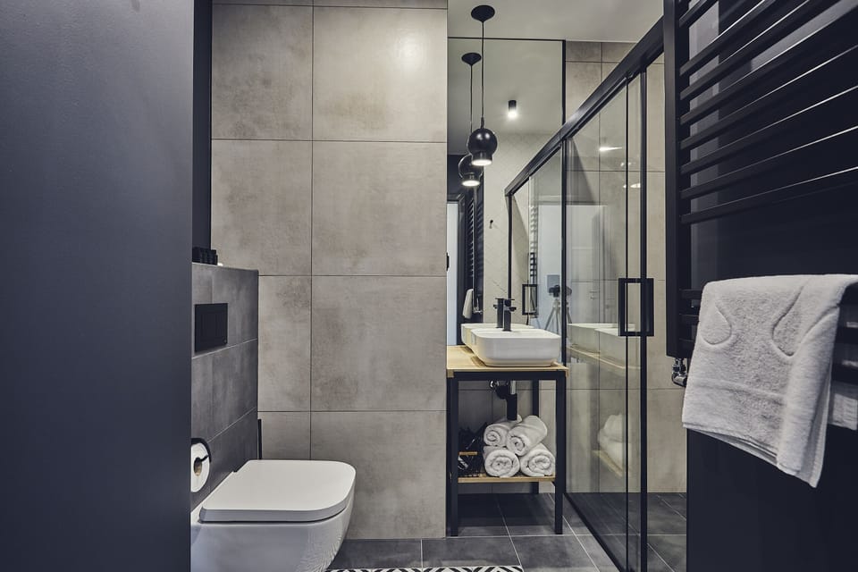 Shower, rainfall showerhead, designer toiletries, hair dryer