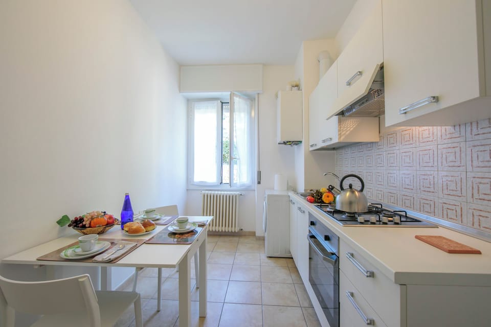 Family Apartment, 2 Bedrooms, Microwave (Casa Al Caprifoglio 600m From Beach) | Private kitchen | Fridge, microwave, oven, stovetop