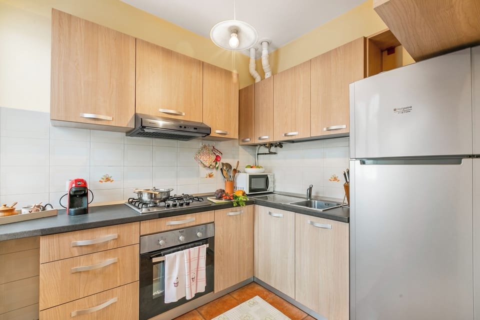 Family Apartment, Multiple Bedrooms (Sunset in Baveno) | Private kitchen | Full-size fridge, microwave, oven, stovetop