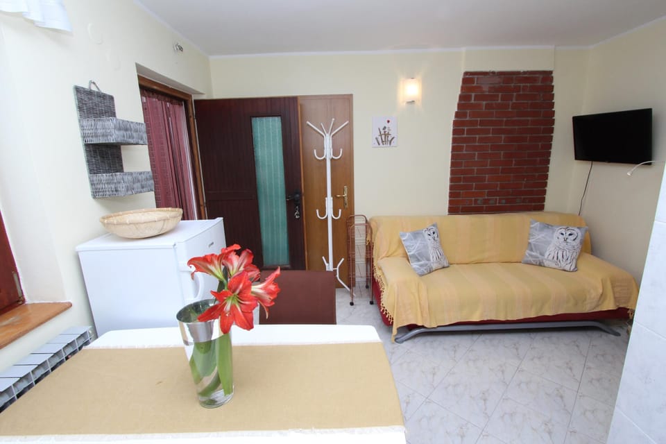Apartment, 1 Bedroom | Living area | Flat-screen TV