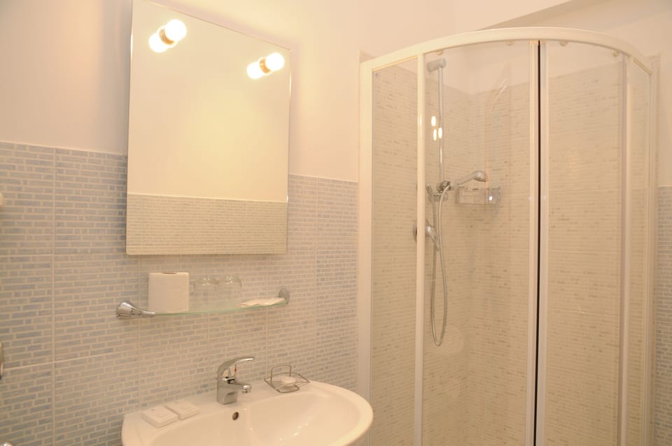 Shower, free toiletries, hair dryer, slippers