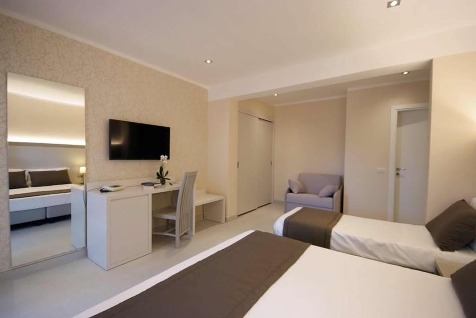 Triple Room, Sea View | Minibar, in-room safe, desk, blackout drapes