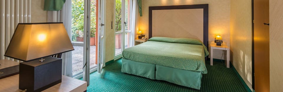 Double Room | Minibar, desk, blackout drapes, cribs/infant beds