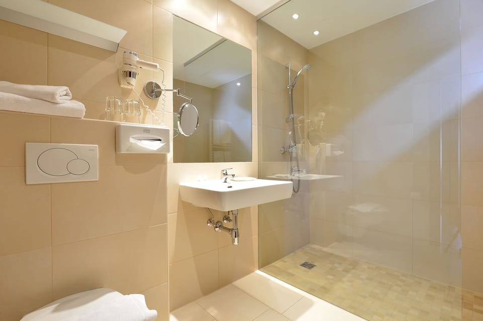 Triple Room, Balcony | Bathroom | Free toiletries, hair dryer, towels