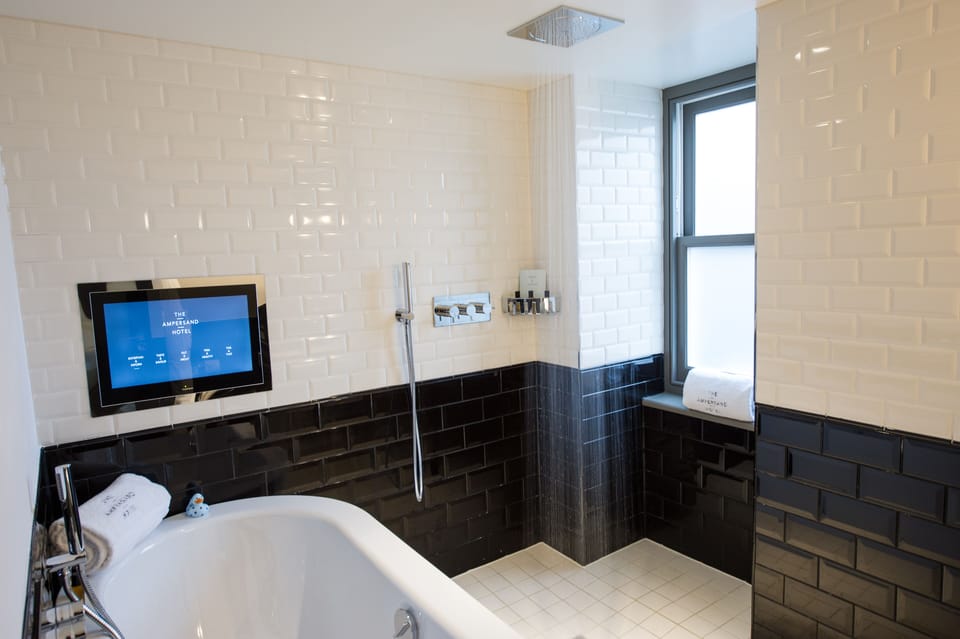 Suite | Bathroom | Designer toiletries, hair dryer, towels