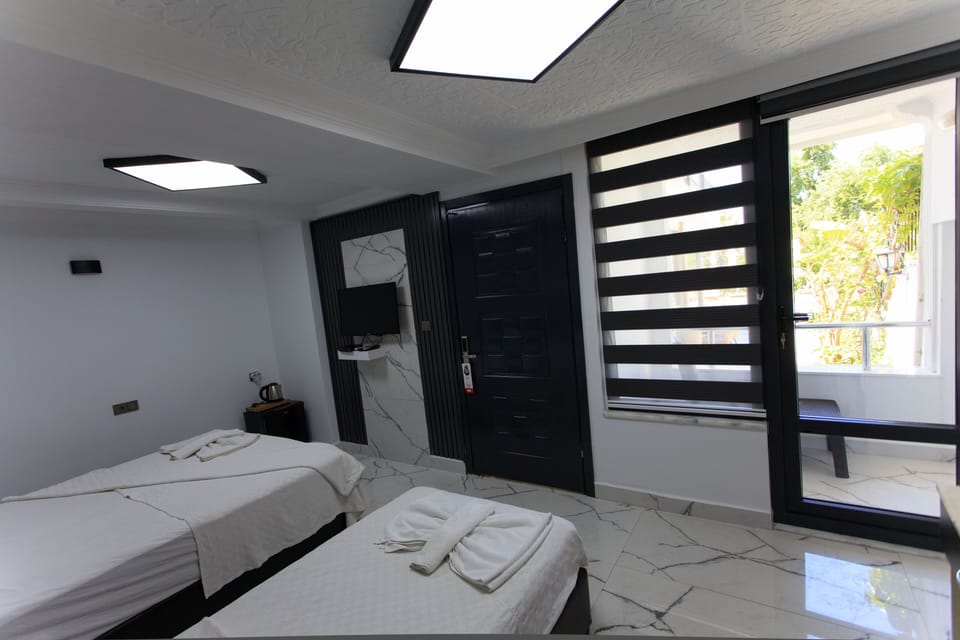 Family Triple Room | Minibar, free WiFi, bed sheets