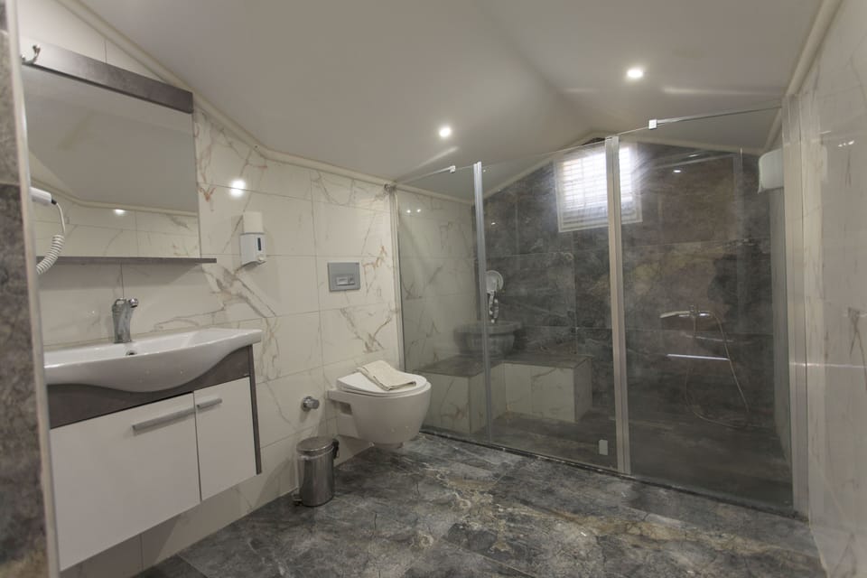 Family Loft ( Five Pax) | Bathroom | Shower, rainfall showerhead, hair dryer, towels