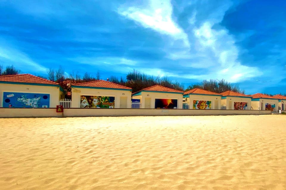 Beach nearby, sun loungers, beach umbrellas, windsurfing