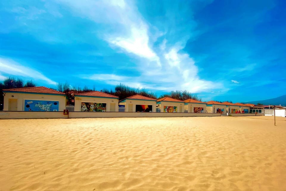 Beach nearby, sun loungers, beach umbrellas, windsurfing