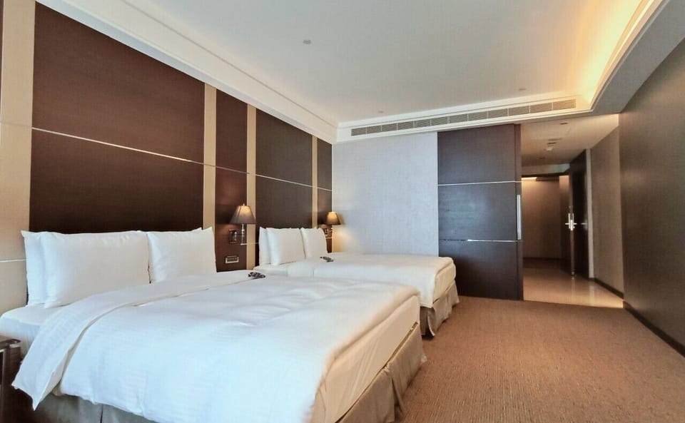 Classic Quadruple Room | Minibar, in-room safe, desk, laptop workspace