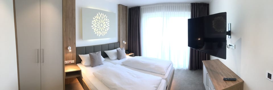 Hypo-allergenic bedding, down comforters, pillowtop beds, in-room safe