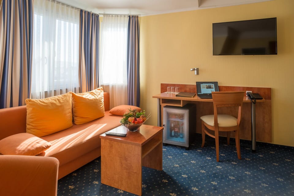 Quadruple Room | Living area | Flat-screen TV