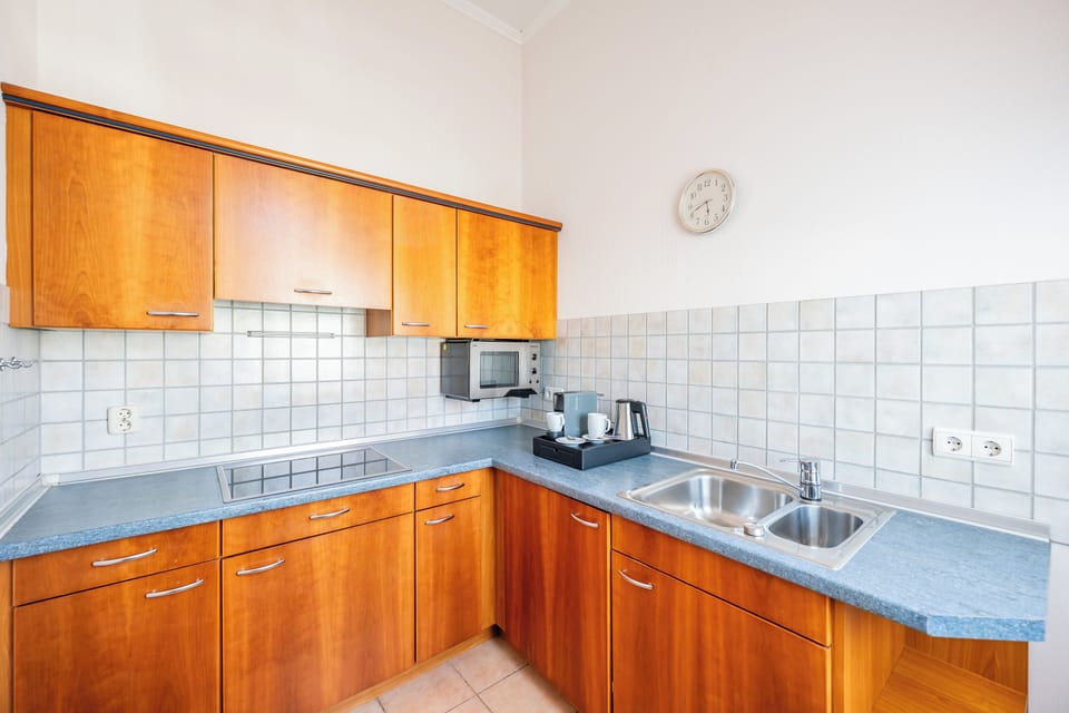 Two-Room Apartment | Private kitchen | Espresso maker, electric kettle, highchair