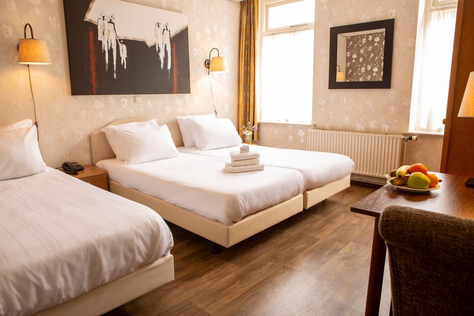 Triple Room | Desk, iron/ironing board (on request), WiFi (free), bed sheets