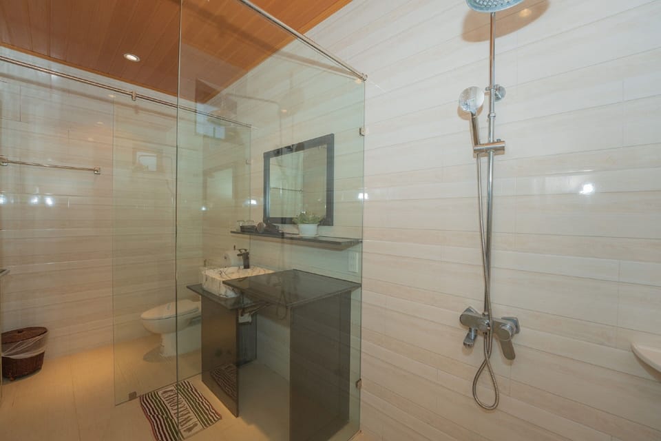 Shower, rainfall showerhead, designer toiletries, hair dryer