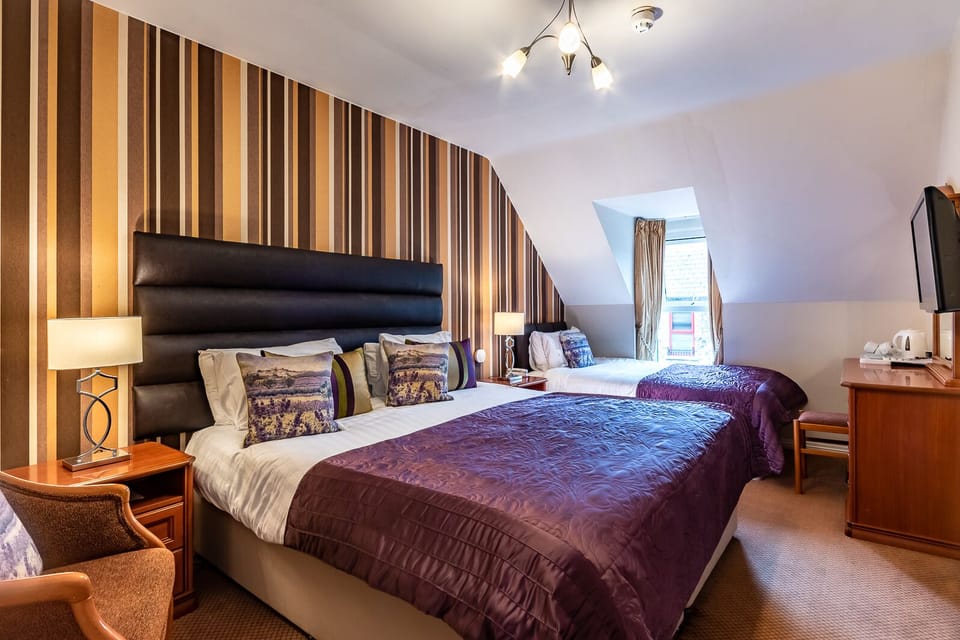 Deluxe Quadruple Room | Individually decorated, individually furnished, desk, blackout drapes