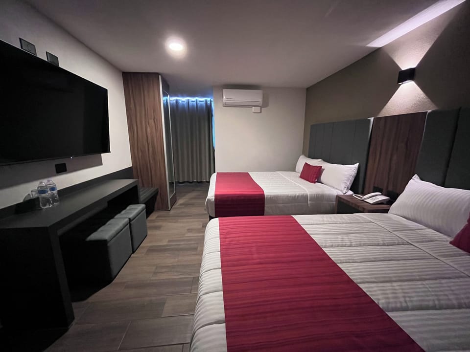 Deluxe Room, 2 Queen Beds | Desk, laptop workspace, free WiFi, bed sheets