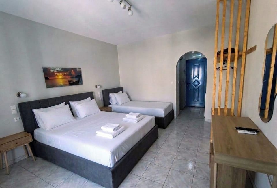 Basic Triple Room, 3 Twin Beds | Desk, blackout drapes, iron/ironing board, free cribs/infant beds
