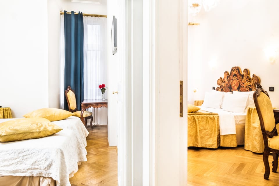 Quadruple Room | Minibar, in-room safe, individually decorated, desk