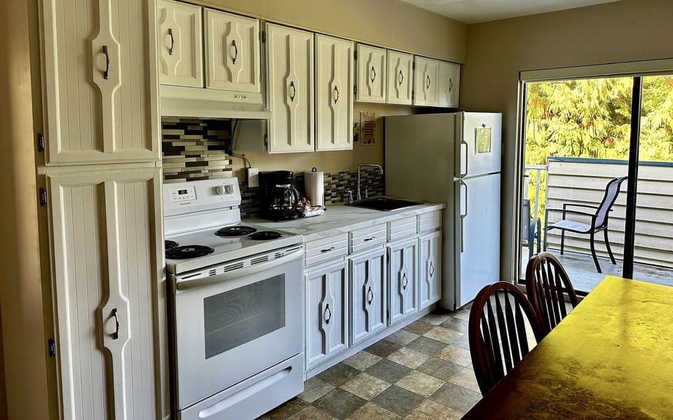 Suite, 2 Bedrooms | Private kitchen | Fridge, microwave, stovetop, coffee/tea maker