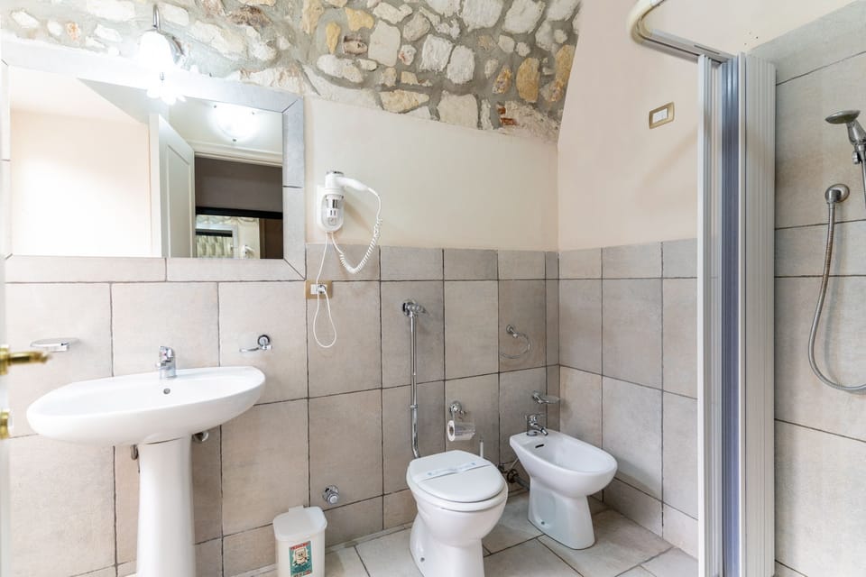Family Quadruple Room | Bathroom | Shower, free toiletries, hair dryer, bidet