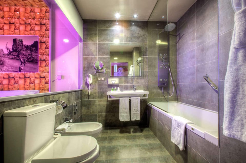 Eco-friendly toiletries, hair dryer, bidet, towels
