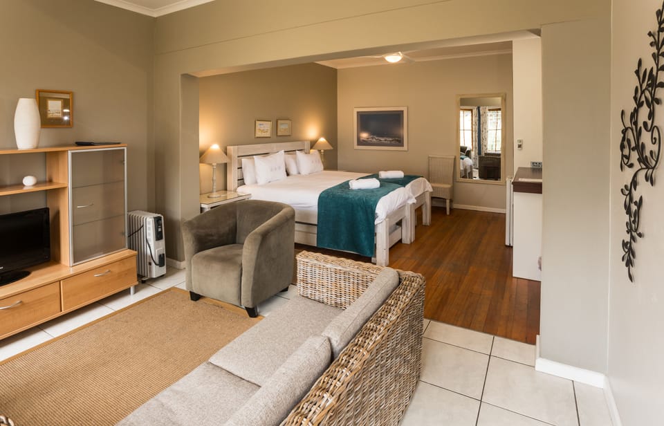 Family Room | Minibar, in-room safe, desk, iron/ironing board (on request)