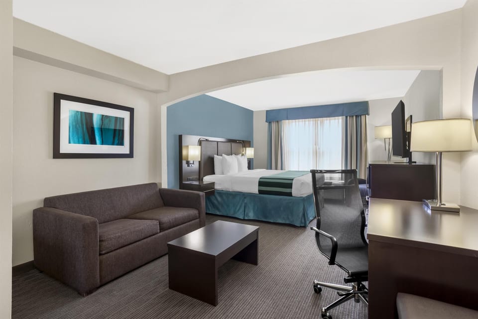 One Bedroom Suite, 1 King Bed, Non Smoking, Refrigerator & Microwave (with Sofabed) | In-room safe, desk, laptop workspace, soundproofing