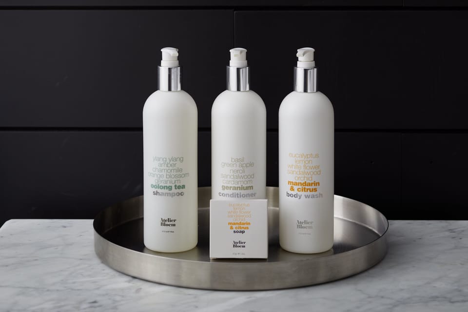 Designer toiletries, hair dryer, bathrobes, towels