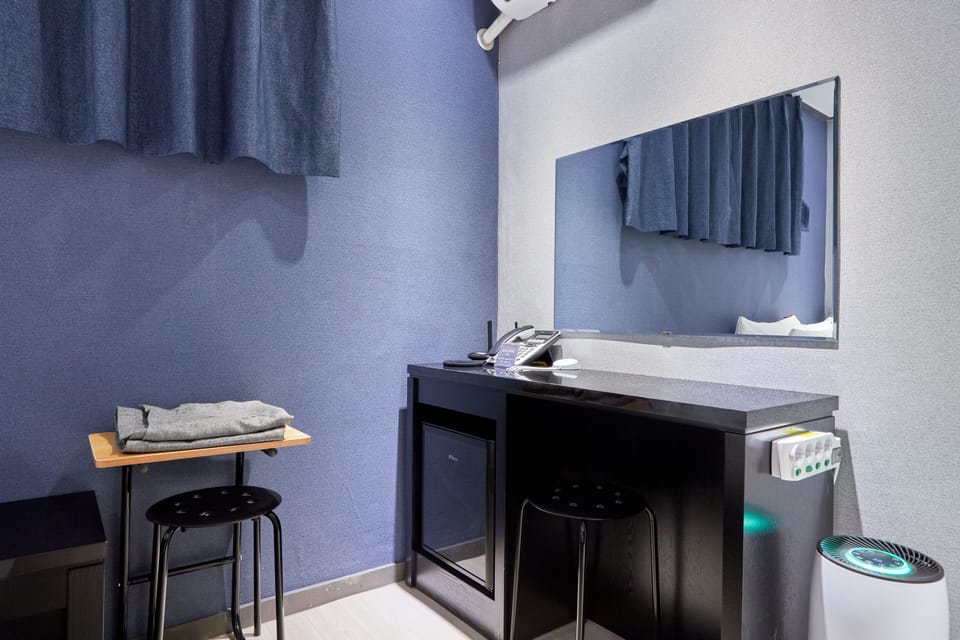 Economy Room, 1 Bedroom | Down comforters, blackout drapes, free WiFi